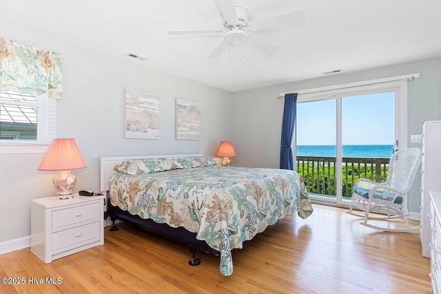 6301 Ocean Dr, Emerald Isle, NC 28594 - bedroom with access to exterior, multiple windows, and light wood finished floors