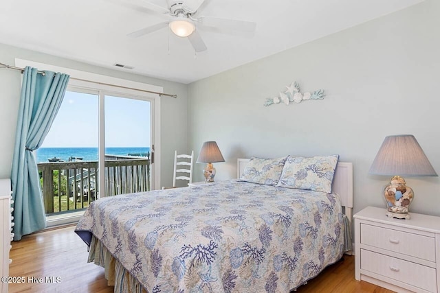 6301 Ocean Dr, Emerald Isle, NC 28594 - bedroom with access to outside, multiple windows, and wood finished floors