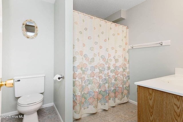 6301 Ocean Dr, Emerald Isle, NC 28594 - bathroom featuring toilet, tile patterned flooring, vanity, and baseboards