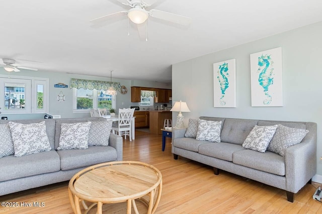 6301 Ocean Dr, Emerald Isle, NC 28594 - living area with a ceiling fan and light wood-style floors