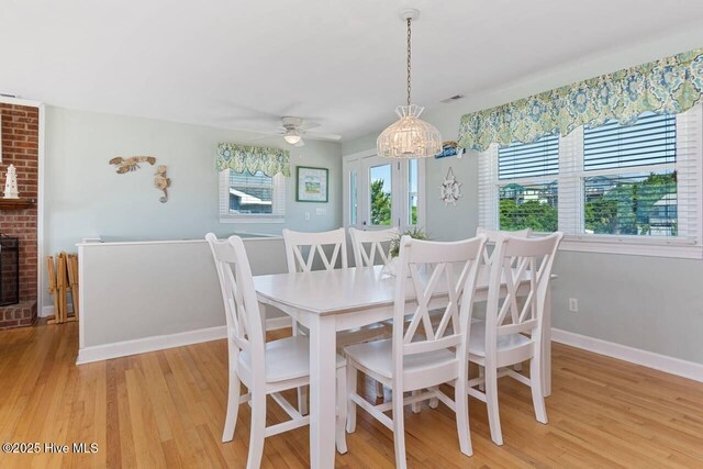 6301 Ocean Dr, Emerald Isle, NC 28594 - dining room featuring light wood finished floors, baseboards, and a ceiling fan