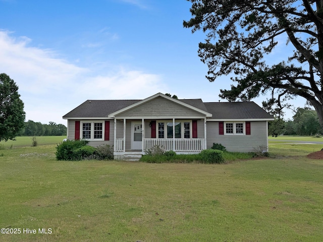 ranch-style home featuring a porch and a front yard