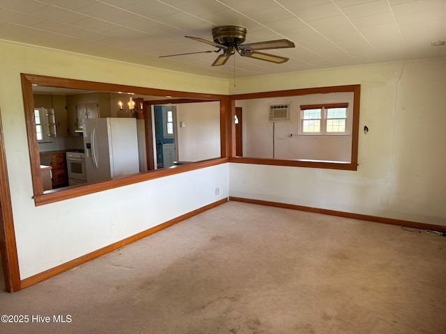 unfurnished room with healthy amount of natural light, carpet, ceiling fan, and a wall unit AC
