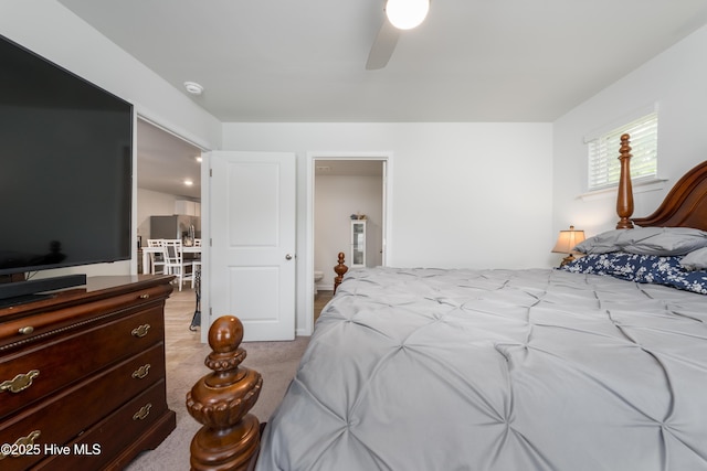bedroom featuring carpet floors, stainless steel fridge with ice dispenser, and ceiling fan
