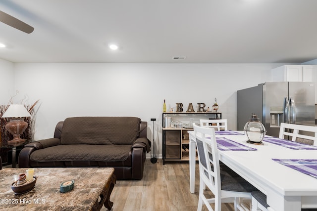 home office featuring light wood-style flooring, ceiling fan, and recessed lighting