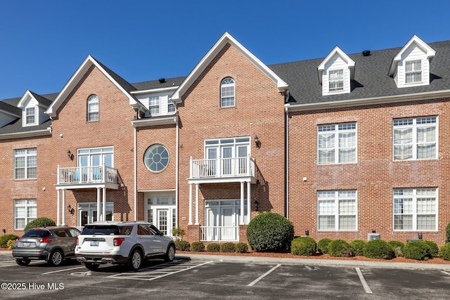 view of property with uncovered parking