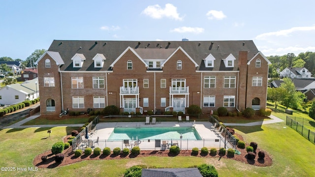 community pool with a residential view