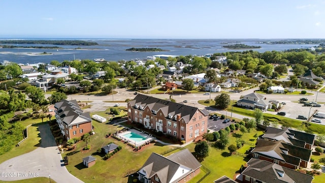 aerial view of residential area with a nearby body of water