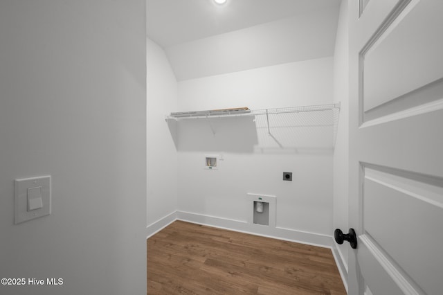washroom featuring electric dryer hookup, hookup for a washing machine, wood finished floors, and baseboards