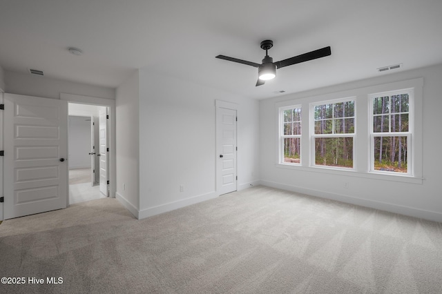 unfurnished bedroom featuring baseboards, carpet, and ceiling fan