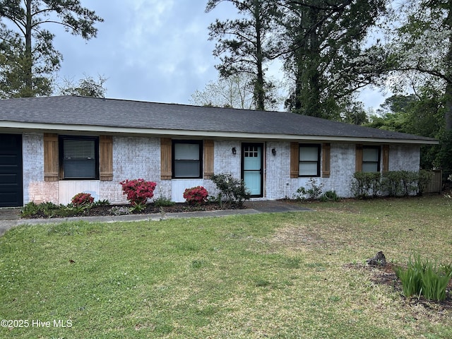 3414 Middle Sound Loop Rd, Wilmington, NC 28411 - ranch-style home featuring brick siding, a front yard, and a shingled roof