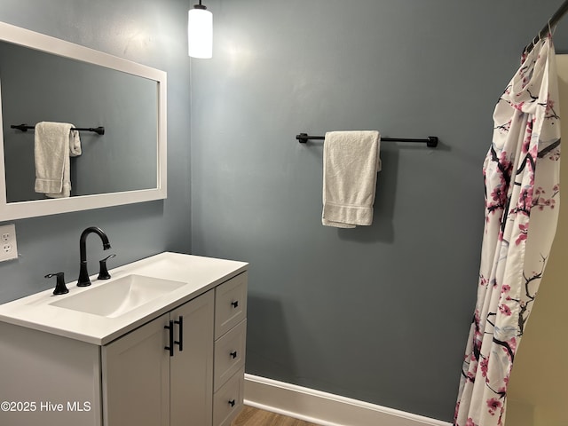 3414 Middle Sound Loop Rd, Wilmington, NC 28411 - full bath featuring vanity, a shower with curtain, and wood finished floors