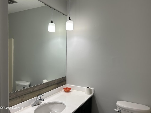 3414 Middle Sound Loop Rd, Wilmington, NC 28411 - bathroom with toilet and vanity