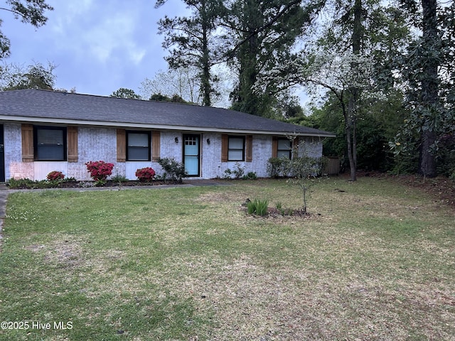 3414 Middle Sound Loop Rd, Wilmington, NC 28411 - ranch-style home with a front lawn, brick siding, central AC, and roof with shingles