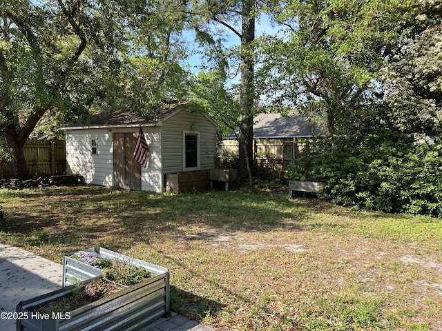 3414 Middle Sound Loop Rd, Wilmington, NC 28411 - view of yard with a vegetable garden and an outbuilding