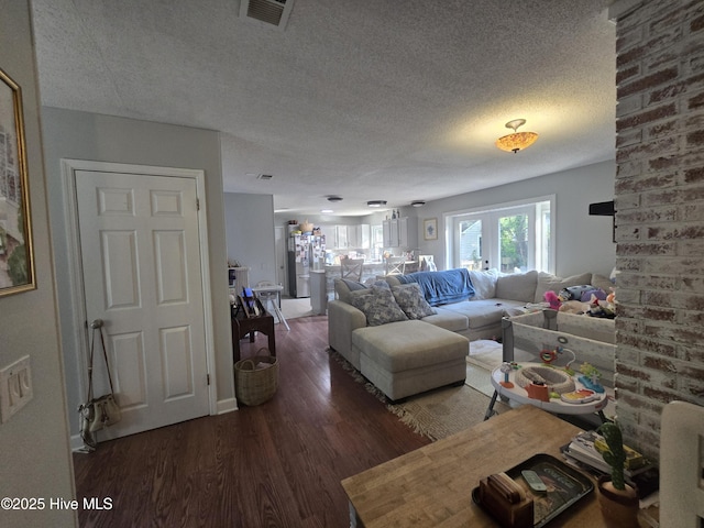3414 Middle Sound Loop Rd, Wilmington, NC 28411 - living room featuring a textured ceiling and wood finished floors
