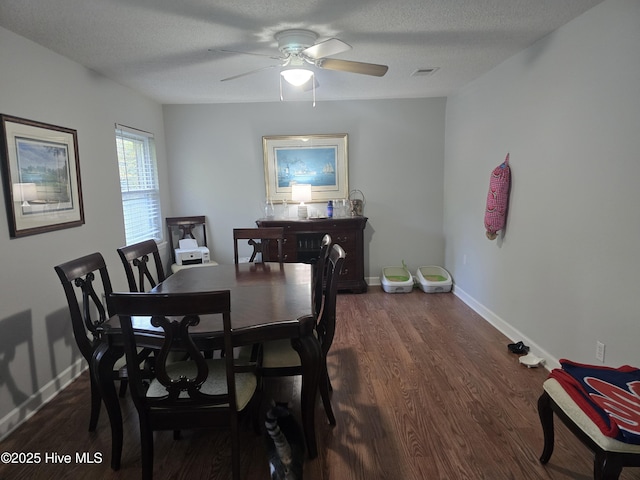 3414 Middle Sound Loop Rd, Wilmington, NC 28411 - dining room featuring dark wood-style floors, a ceiling fan, and baseboards