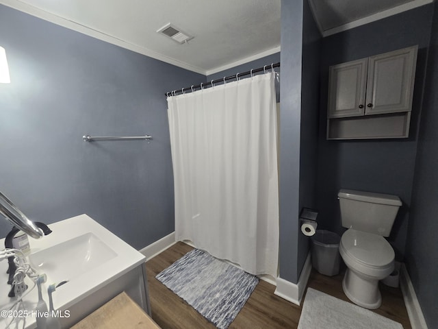 3414 Middle Sound Loop Rd, Wilmington, NC 28411 - full bath featuring toilet, wood finished floors, a shower with shower curtain, baseboards, and crown molding