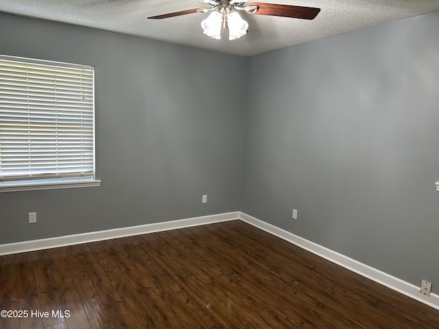 3414 Middle Sound Loop Rd, Wilmington, NC 28411 - unfurnished room with a ceiling fan, dark wood finished floors, baseboards, and a textured ceiling