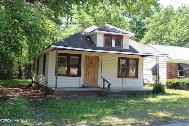 933 Tyan St, Rocky Mount, NC 27801 - bungalow-style home featuring a front lawn, a porch, and roof with shingles