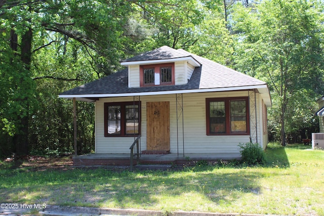 933 Tyan St, Rocky Mount, NC 27801 - bungalow-style house with covered porch, a front lawn, and a shingled roof