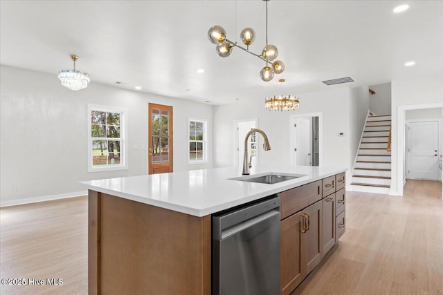 355 S Middleton Dr NW, Calabash, NC 28467 - kitchen with dishwasher, a chandelier, a sink, light wood finished floors, and light countertops