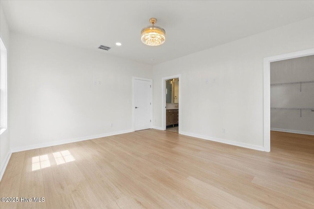 355 S Middleton Dr NW, Calabash, NC 28467 - empty room with light wood-style flooring, baseboards, recessed lighting, and a chandelier