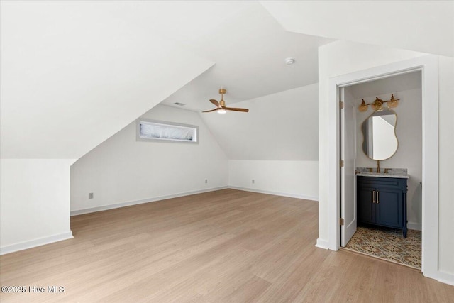355 S Middleton Dr NW, Calabash, NC 28467 - additional living space featuring light wood-style floors, vaulted ceiling, ceiling fan, and baseboards