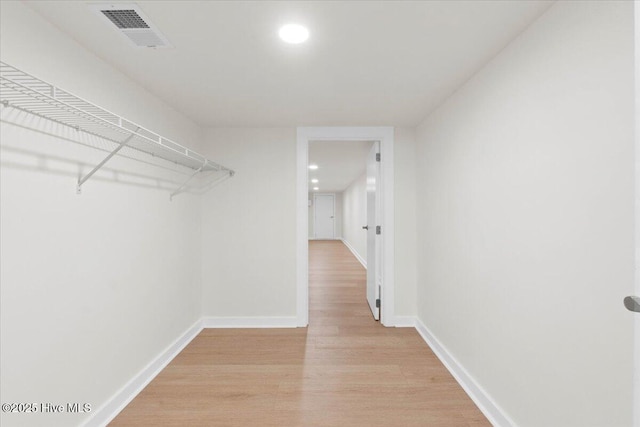 355 S Middleton Dr NW, Calabash, NC 28467 - walk in closet with light wood-type flooring