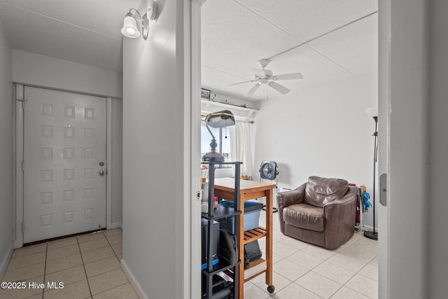 entryway with light tile patterned flooring and ceiling fan