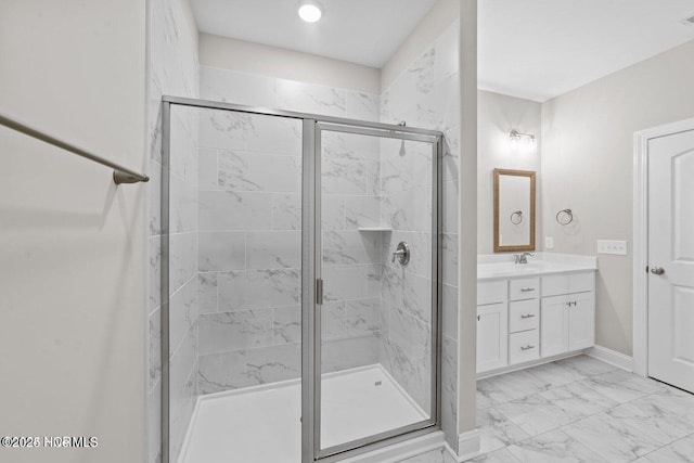 bathroom with a shower stall, marble look tile flooring, vanity, and baseboards