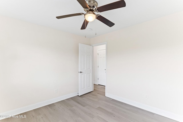 empty room with light wood-type flooring, baseboards, and ceiling fan