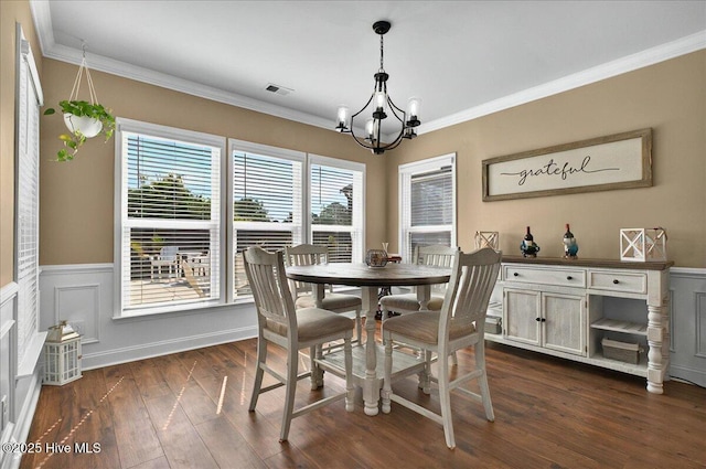 97 Eagle Claw Dr, Calabash, NC 28467 - dining area with a chandelier, dark wood-style floors, wainscoting, and ornamental molding