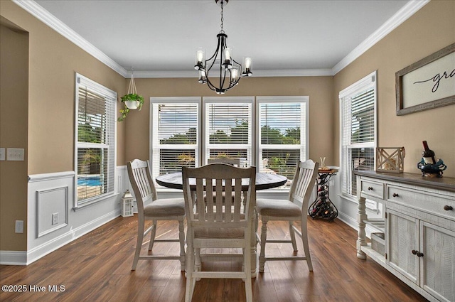 97 Eagle Claw Dr, Calabash, NC 28467 - dining room featuring a chandelier, dark wood-style flooring, healthy amount of natural light, ornamental molding, and baseboards