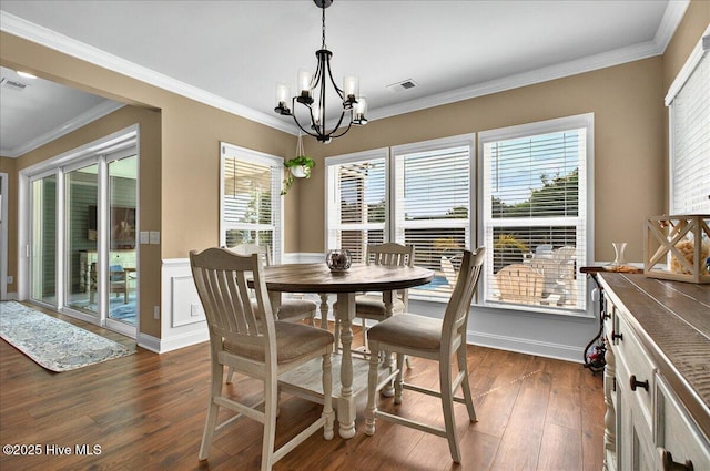 97 Eagle Claw Dr, Calabash, NC 28467 - dining room with a chandelier, dark wood-type flooring, and crown molding