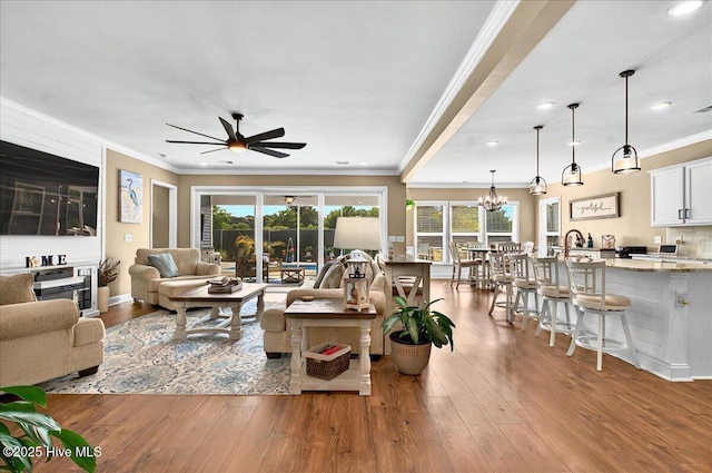 97 Eagle Claw Dr, Calabash, NC 28467 - living area featuring a ceiling fan, plenty of natural light, crown molding, hardwood / wood-style flooring, and recessed lighting