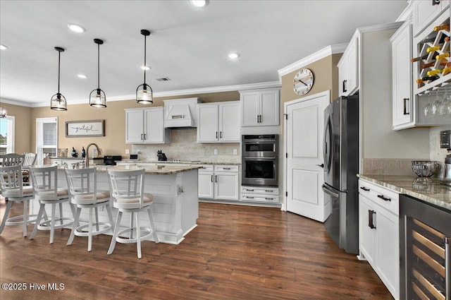 97 Eagle Claw Dr, Calabash, NC 28467 - kitchen with beverage cooler, appliances with stainless steel finishes, crown molding, tasteful backsplash, and a breakfast bar