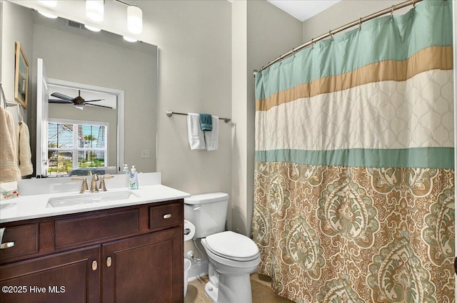 97 Eagle Claw Dr, Calabash, NC 28467 - bathroom featuring vanity, toilet, a ceiling fan, tile patterned floors, and a shower with shower curtain