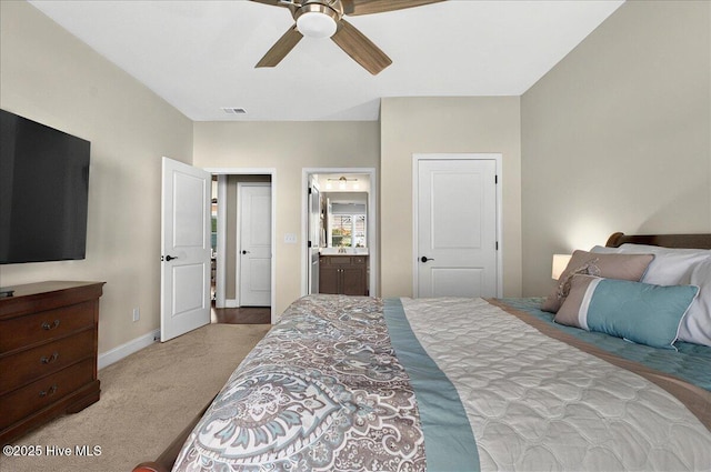97 Eagle Claw Dr, Calabash, NC 28467 - carpeted bedroom with baseboards, ensuite bathroom, and ceiling fan