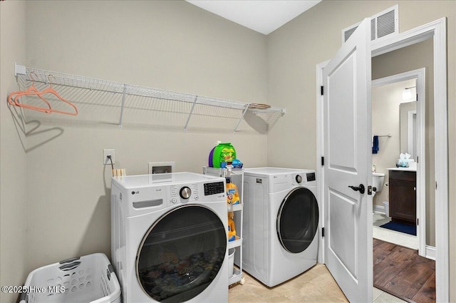97 Eagle Claw Dr, Calabash, NC 28467 - washroom featuring separate washer and dryer and light wood-style flooring