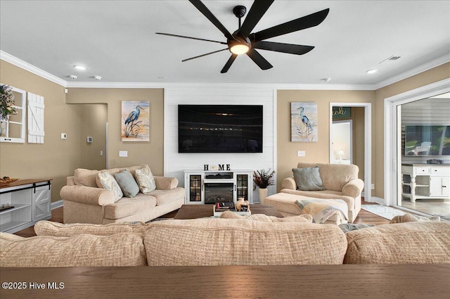 97 Eagle Claw Dr, Calabash, NC 28467 - living area featuring a ceiling fan, ornamental molding, recessed lighting, baseboards, and a glass covered fireplace