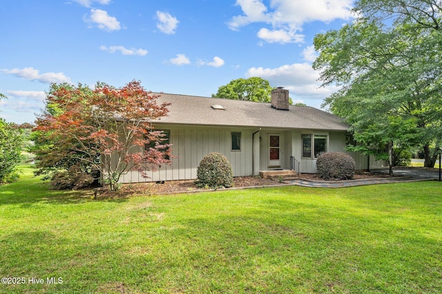 106 Millstone Rd, West End, NC 27376 - ranch-style home with a chimney, a front yard, and roof with shingles