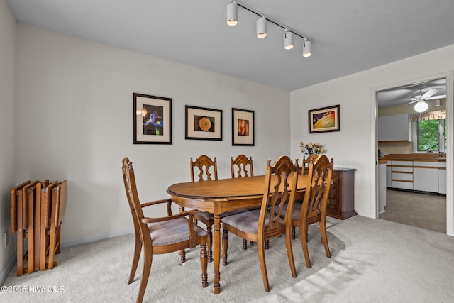 106 Millstone Rd, West End, NC 27376 - dining space with light carpet, track lighting, and ceiling fan
