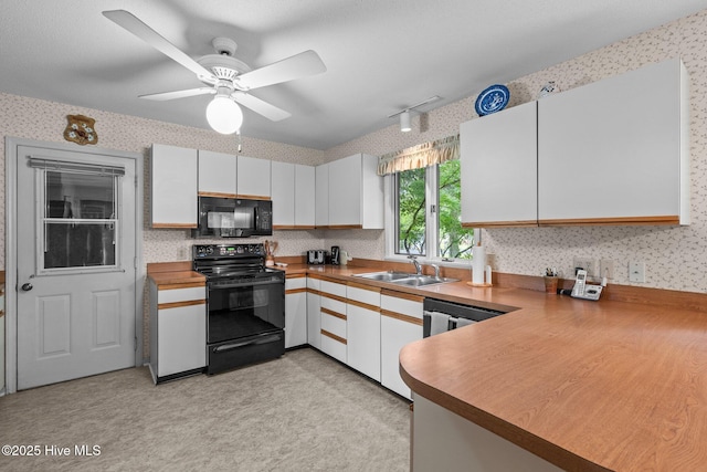 106 Millstone Rd, West End, NC 27376 - kitchen with black appliances, wallpapered walls, a sink, ceiling fan, and white cabinets