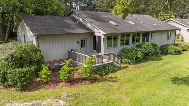 106 Millstone Rd, West End, NC 27376 - rear view of house with a yard, roof with shingles, a wooden deck, and cooling unit