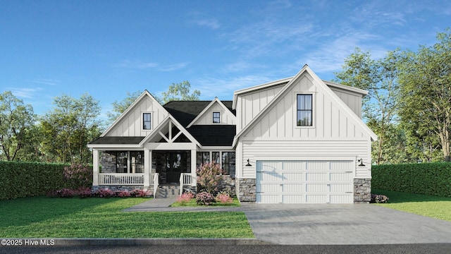 view of front of property featuring board and batten siding, stone siding, a front yard, and driveway