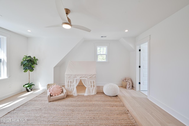 rec room with wood finished floors, recessed lighting, ceiling fan, and baseboards