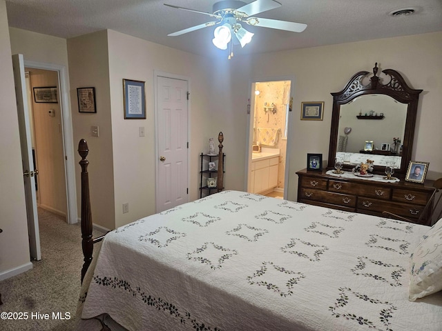 bedroom featuring carpet flooring, baseboards, a ceiling fan, and connected bathroom