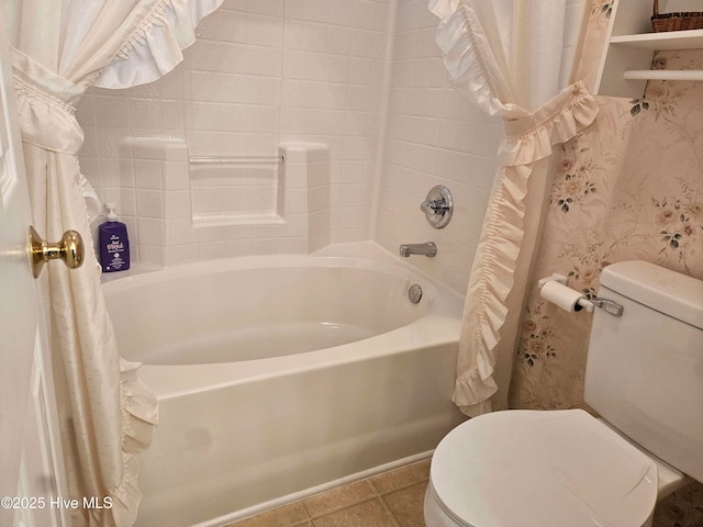 full bath featuring toilet, tile patterned floors, and shower / bath combo