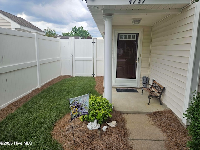 property entrance with a gate and fence